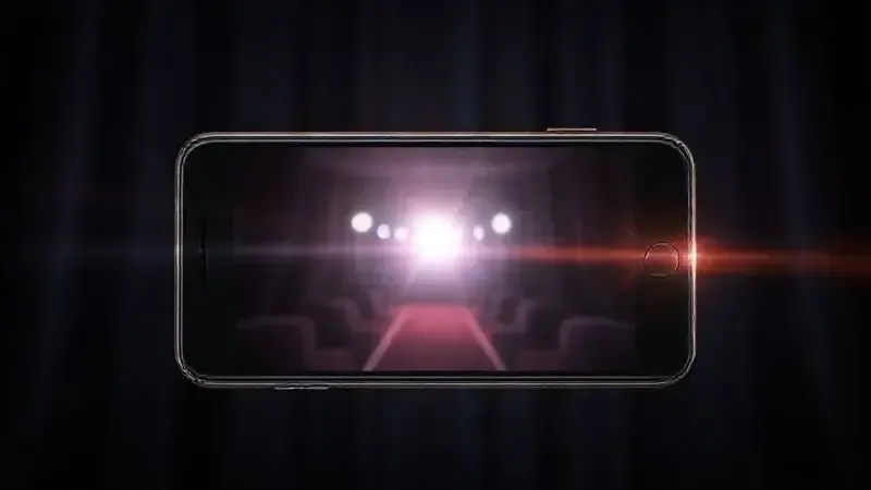 Renderização artística da tela de um smartphone mostrando um vídeo cinematográfico, ilustrando a qualidade do Modo Cinema das câmeras.